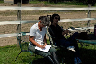 Julie taking notes while Bettina Drummond coaches her students